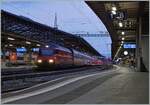 A SBB Re 460 with a IR90 to Brig in the early morning in Lausanne.