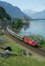 SBB Re 460 wiht an IR service to Geneva by the Castle of Chillon. 
08.06.2010