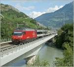 Re 460 022-7 with IR on the Rhone Bridge by Leuk.