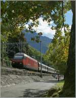 The SBB Re 460 017-7 by the Castle of Chillon.