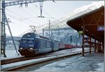 BLS RE 465 AND a SBB Re 6/6 with a Cargo train in Brig. 
Analog picture/January 2000
