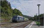 The BLS Re 465 006 with a RE from Bern to La Chaux-de-Fonds in Chambrelien.