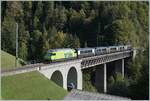 The BLS Re 465 002 (UIC 91 85 4465 002-4) drives with its GoldenPass Express GPX 4068 from Montreux to Interlaken Ost near Weissenburg over the Bunschenbach Bridge.

Oct 7, 2023
