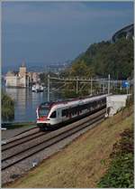 A SBB RABe 523 Flirt on the way to Allaman by the Castle of Chillon.