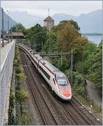 A SBB ETR 610 from Milan to Geneva by the Castle of Chillon.