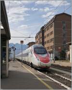 A SBB ETR 610 on the way from Milano to Geneva is arriving at the Domodossola Station.
