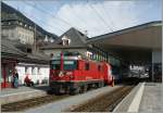 In Disentis the Glacier-Express have to Change the Locomotive and the Rhb ge 4/4 II 620 makes place for the MBG HGe 4/4 103.
