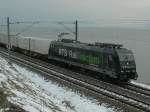 On a dark fog day runs the RTS Re 185 along the lake of Geneva. 
(by Rivaz, 26.01.2007)