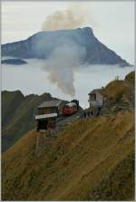 A BRB Steamer train is arrived on the summit Station Brienzer Rothorn. 
29.09.2012