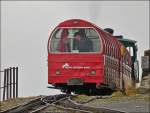 . A BRB train is leaving the summit station Rothorn Kulm on September 29th, 2013.