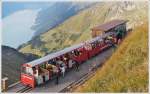. The passengers are leaving the BRB train in the upper terminus Rothorn Kulm on September 28th, 2013.