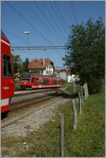 At the platform one in Le Noiremont is arriving the local train to La Chaux-de-Fonds.