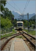 A FART Centovalli Express is arriving at Druogno Station.