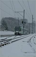 LEB local train to Lausanne Flon is leaving Jouxtens-Mzery.
