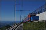 A MG Monte Generoso Bhe 4/8 is arriving at the summit station Generoso Vetta.
21.05.2017