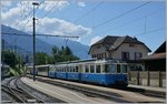 The MOB ABDe 8/8 4002  VAUD  with a local train to Montreux in Chernex.