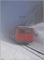 The RB BDhe 2/4 N° 4 is comming out of the fog by The Staffelhöhe.