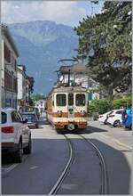 A A-L local train from Leysin to Aigle in the small street of the old town in Aigle. 04.06.2023