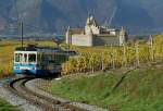 An ASD local train service by the Castle of Aigle in the vineyard.