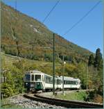 The LEB Bt and Be 4/4 is engaged in an ASD Local train service here by over Aigle in the vineyards.