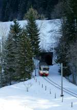 The TRN/CMN Be 4/4 is coming out of the 721 long  Petit Mont  tunnel.
18.01.2010