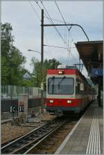 A WB local train is leaving Liestal.