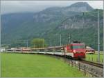 A  Classic  Brnig fast-train is leaving Meiringen to Luzern.