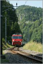The  zentalbahn  HGe 101 968-2 with an Brnigbahn IR from Interlaken Ost to Luzern near Kppeli. 
20. 08.2012