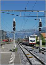 A zbIR  Luzern Engelberg-Interlaken Express  is arriving at Meiringen.