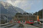 RhB Ge 4/4 III with the  Winter Glacier Express and RE on the way to St Moritz is arriving at Reichenau Tamins.
