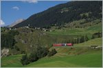 A RhB Ge 6/6 II with fast train from St Moritz to Chur near BErgün Bravuogn.