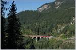 A RhB Fast-Train Service from Chur to St Moritz on the Schmittertoble Bridge near Filisur.