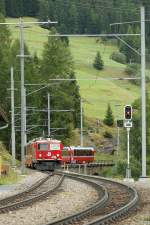 Ge 4/4 with the Bernina Express is arriving at Bergn station.