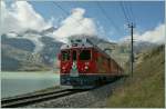 RhB ABe 4/4 N 54 and an other one with a Bernina Express by the Lago Bianco.