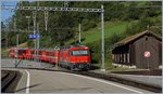 The red RhB Ge 4/4 III 648 wiht a local train to Davos is leaving Filisur. 
12.09.2016