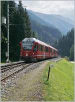 RhB local train is arriving at the Davons Monstein Station.