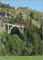 A RhB Ge 4/4 II with a RE to Disentis by Guarda. 
11.09.2011
