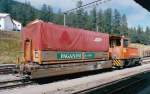 Rhaetian Railway - Flat Wagon used for hauling Roll-off Containers (ACTS Containers) in station Pontresina, August 2000 