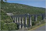 The TGV Lyria 9765 from Paris to Geneva on the 269 meter long Cize-Bolozon Viaduct.