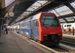 . The Re 450 028-6 as RE to Aarau is waiting for passengers in Zrich main station on June 5th, 2015.