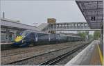 A Southeastern High Speed Service to London St Pancras in Canterbury by a heavy rain and wind.