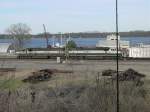 SD70MAC Burlington Northern 9709 & 9689 roll through the Burlington, Iowa yard with 117 empty aluminum coal cars on 9 Apr 2005. Mississippi River in background.