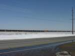 Various A mixed freight with 9 BNSF dieselloks is finally over the hill and now picking up speed as it heads west with a near 200 car consist. 3 Mar 10