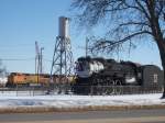 Various Chicago, Burlington & Quincy 4-6-4 Hudson no. 3003 and a sand tower partially block former Santa Fe BNSF 522 and an unknown number diesel locomotive. The 3003 rests at the Burlington, Iowa depot since 1961.