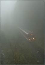 zb-zentralbahn-brunig Trough the heavy fog is coming a train to Engelberg  by Gr�nenwald. 18.10.2010 