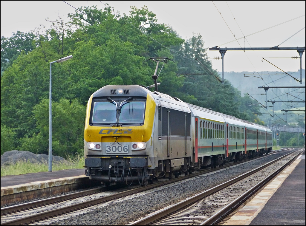 . 3006 is hauling the IR 108 Luxembourg City - Liers into the station of Wilwerwiltz on June 14th, 2013.