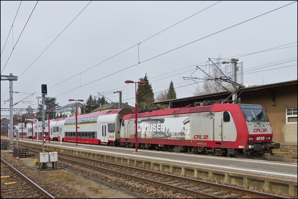 . 4010 is entering with bilevel cars into the station of Wasserbililg on April 8th, 2013. 