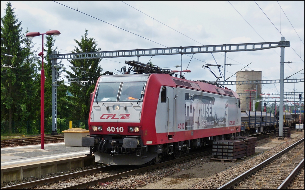 . 4010 is hauling a freight train through the station of Wasserbillig on June 14th, 2013.