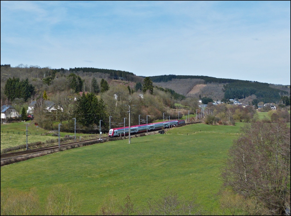 . The IR 3712 Luxembourg City - Troisvierges photographed in the nice landscape between Wilwerwiltz and Enscherange on April 14th, 2013.