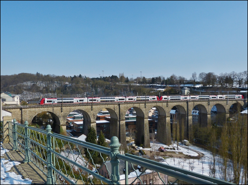 . The IR 3714 Luxembourg City - Troisvierges is running on the viaduct of Clausen in Luxembourg City on March 15th, 2013.